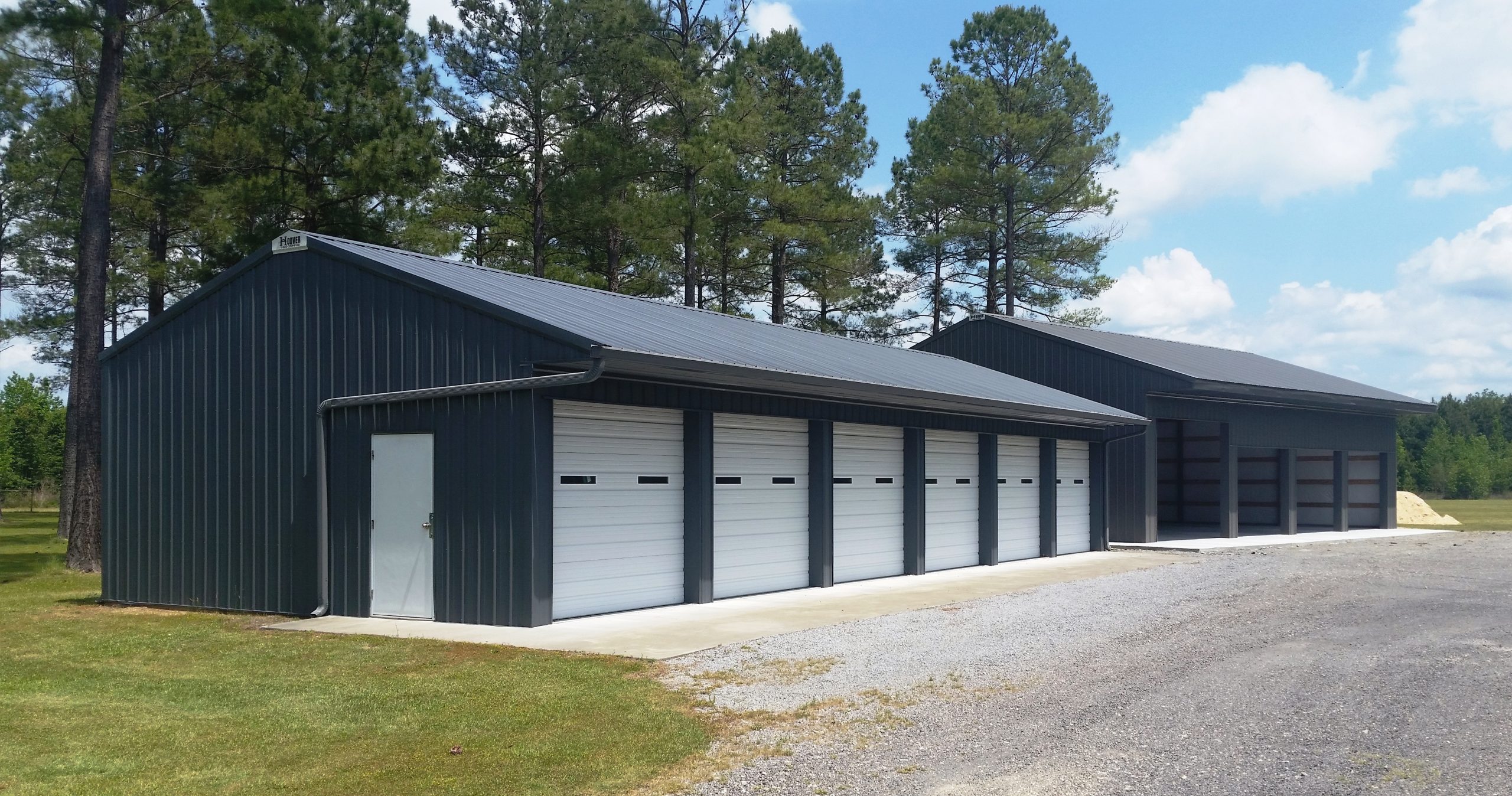Large steel pole building with multiple overhead doors